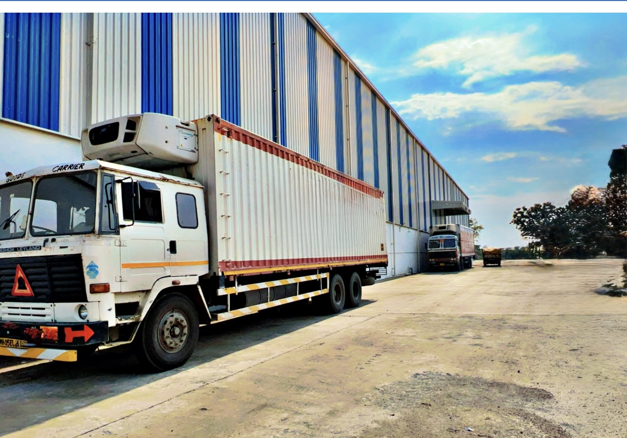 Facility exterior with trucks